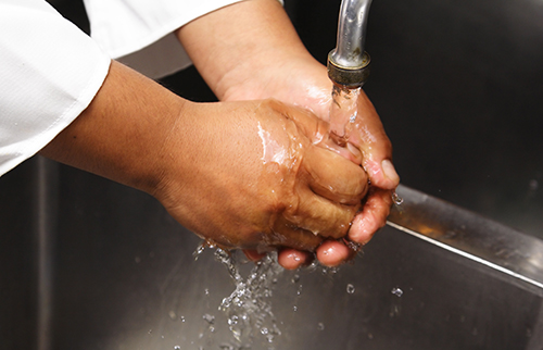 hand washing in foodservice sink